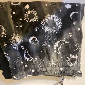 Never worn sweat pants ! Split style sun & moon w/ other side plain black !